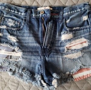 Two pairs of ripped jeans shorts